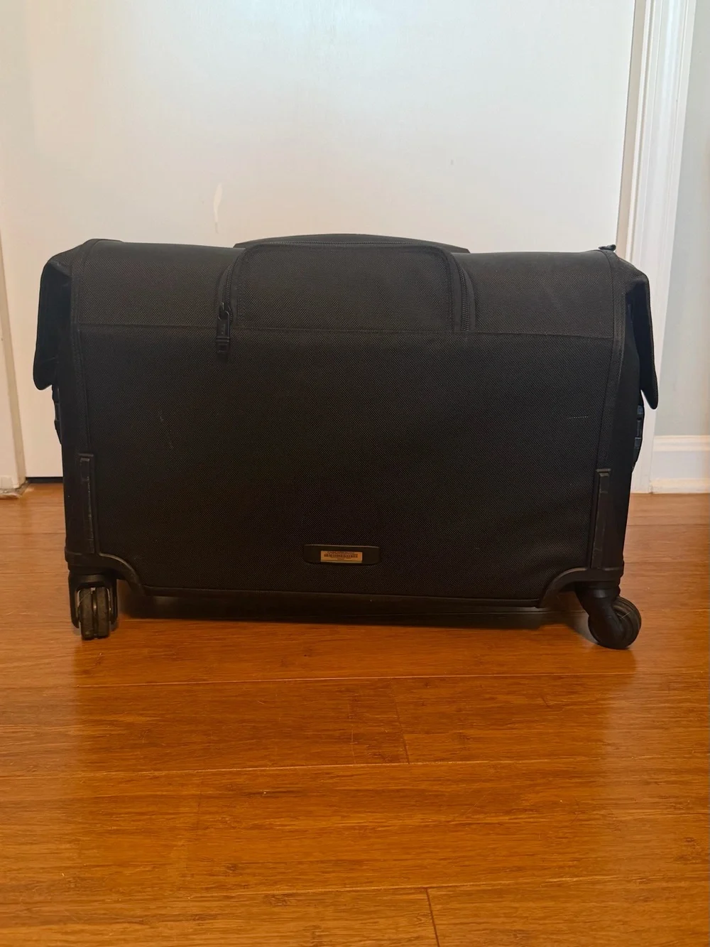 Tumi Black Garment Spinnerwith Front Organization Pockets